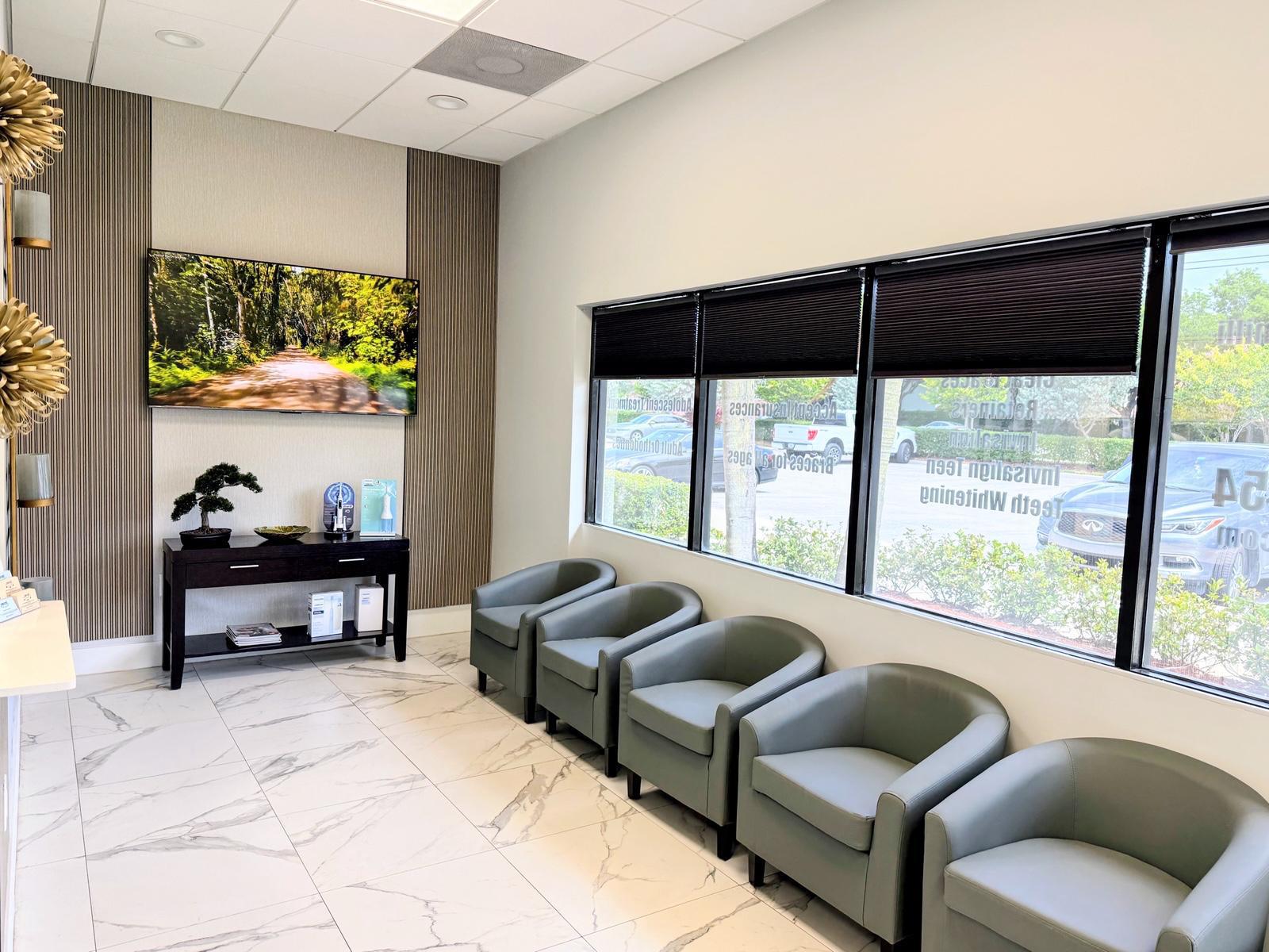 Coral Orthodontics bright waiting room with windows